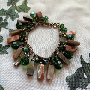 Vintage abalone shell and aurora borealis bead charm bracelet.